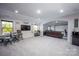 Finished basement featuring a wet bar, seating, and a projector for entertainment at 5051 Hyannis Ct, Matthews, NC 28104