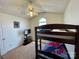 Bedroom with carpeted floor, a small arched window, and a TV on a stand at 5065 Gateway Dr, Claremont, NC 28610