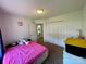 Cozy bedroom featuring carpeted floors, a closet, and access to the ensuite bathroom at 5065 Gateway Dr, Claremont, NC 28610