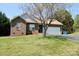 Charming single-story brick home featuring a well-manicured lawn and an attached two-car garage at 5065 Gateway Dr, Claremont, NC 28610