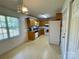 Functional kitchen featuring wood cabinetry, ample counter space, and natural light from the window at 5065 Gateway Dr, Claremont, NC 28610