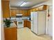 Functional kitchen featuring classic wood cabinetry, ample counter space, and essential appliances at 5065 Gateway Dr, Claremont, NC 28610