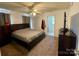 Comfortable main bedroom with carpet, fan, neutral paint, and natural light from the window at 5065 Gateway Dr, Claremont, NC 28610