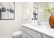 Bright bathroom featuring a white sink, vanity, mirror, and a shower behind glass at 5124 Fireweed Ct, Dallas, NC 28034