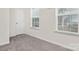 Bedroom with neutral carpeting, two windows, and a closet at 5124 Fireweed Ct, Dallas, NC 28034