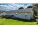 Back of house featuring deck, well-maintained lawn, and fenced yard at 5184 Swinging Bridge Rd, Conover, NC 28613