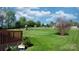 Large backyard with lush lawn, patio and a playground at 5184 Swinging Bridge Rd, Conover, NC 28613