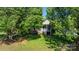 Charming single-Gathering home featuring a welcoming front porch and lush landscaping at 5184 Swinging Bridge Rd, Conover, NC 28613
