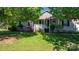 Charming single-Gathering home featuring a cozy front porch, lush landscaping, and inviting curb appeal at 5184 Swinging Bridge Rd, Conover, NC 28613