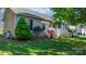 Landscaped front yard with lush green lawn, shrubs, and charming exterior at 5184 Swinging Bridge Rd, Conover, NC 28613