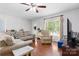 Bright living room with hardwood floors, comfortable seating, and a view of the outdoors at 5184 Swinging Bridge Rd, Conover, NC 28613