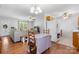 Open living space with hardwood flooring seamlessly connects the living room, dining area, and kitchen at 5184 Swinging Bridge Rd, Conover, NC 28613