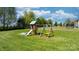 Backyard view of a play set in the yard at 5184 Swinging Bridge Rd, Conover, NC 28613