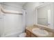 Full bathroom with shower/tub combo, single sink vanity with a framed mirror and light fixture at 562 New Bern Station Ct, Charlotte, NC 28209