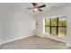 Bedroom featuring a ceiling fan and bright windows at 562 New Bern Station Ct, Charlotte, NC 28209