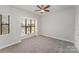 Bright bedroom with carpet, natural light from large window and ceiling fan at 562 New Bern Station Ct, Charlotte, NC 28209