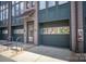 Townhome with attached garage and street access, featuring covered entry and brick facade at 562 New Bern Station Ct, Charlotte, NC 28209