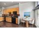 Cozy kitchen featuring maple cabinets, granite countertops, and a charming breakfast nook at 562 New Bern Station Ct, Charlotte, NC 28209