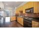 Open kitchen with granite counters, stainless appliances, and access to a bright living area at 562 New Bern Station Ct, Charlotte, NC 28209