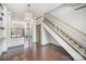 Open-concept living area showcasing hardwood floors, staircase, and neutral paint scheme at 562 New Bern Station Ct, Charlotte, NC 28209