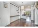 Open-concept living area with hardwood floors, designer lighting, and access to the kitchen at 562 New Bern Station Ct, Charlotte, NC 28209