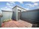 Roof deck featuring tiled flooring, greenery, and a view of the sky at 562 New Bern Station Ct, Charlotte, NC 28209