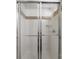 Modern shower features white tiles, a tiled shower, and glass doors at 562 New Bern Station Ct, Charlotte, NC 28209