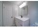 Bathroom featuring a modern vanity, mirror, and recessed lighting at 600 Burns St, Wadesboro, NC 28170