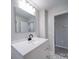 Bathroom with modern vanity, sleek fixtures, and a large mirror at 600 Burns St, Wadesboro, NC 28170