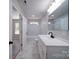 Bathroom with a modern vanity and marble-look tile at 600 Burns St, Wadesboro, NC 28170