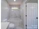 Bathroom with a shower-tub combination and modern fixtures at 600 Burns St, Wadesboro, NC 28170