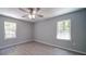 Simple bedroom with two windows providing natural light and clean design at 600 Burns St, Wadesboro, NC 28170