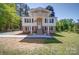 Charming two-story home featuring a welcoming entrance and a well-manicured front yard at 600 Burns St, Wadesboro, NC 28170