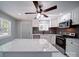 Modern kitchen with stainless steel appliances, white cabinets, and marble countertops at 600 Burns St, Wadesboro, NC 28170