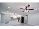 Open-concept kitchen area featuring stainless steel appliances and eat in area with windows at 600 Burns St, Wadesboro, NC 28170