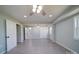 Open floorplan in the living room with light gray walls, ceiling fan, and wood-look flooring at 600 Burns St, Wadesboro, NC 28170