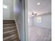 Living space featuring neutral walls, wood-look floors, and staircase at 600 Burns St, Wadesboro, NC 28170