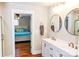 Bathroom with double sinks, modern fixtures and wood floors at 606 Childs St, Lincolnton, NC 28092