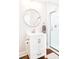 Modern bathroom featuring a glass enclosed shower, a round mirror, and vanity at 606 Childs St, Lincolnton, NC 28092