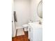 Well-lit half-bathroom with modern vanity and fixtures at 606 Childs St, Lincolnton, NC 28092