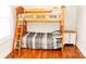 Charming bedroom with wooden bunk beds and a striped comforter at 606 Childs St, Lincolnton, NC 28092
