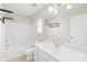 Bathroom with large mirror and vanity next to tub and shower at 6418 Castlewynd Ct, Charlotte, NC 28212