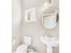 Half bathroom featuring a pedestal sink, toilet, and natural light at 6418 Castlewynd Ct, Charlotte, NC 28212