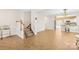Bright and spacious living room featuring tile floors and a view into the kitchen area at 6418 Castlewynd Ct, Charlotte, NC 28212