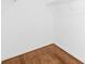 Walk-in closet featuring hardwood floors and wire shelving at 6418 Castlewynd Ct, Charlotte, NC 28212