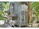 Charming two-story home with covered entryway, deck, and mature trees at 6523 Clavell Ln, Charlotte, NC 28210