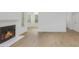 Bright living room featuring a fireplace and wood flooring, creating a warm and inviting space at 6523 Clavell Ln, Charlotte, NC 28210