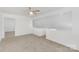 Upstairs living room has vaulted ceilings and neutral carpet at 6523 Clavell Ln, Charlotte, NC 28210