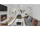 Bright living room with fireplace, contemporary decor, and ample natural light showcasing a cozy and inviting space at 6523 Clavell Ln, Charlotte, NC 28210