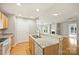 Open kitchen featuring granite countertops, island, and breakfast bar at 718 W Trade St # 708, Charlotte, NC 28202